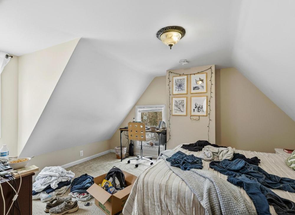 Bedroom before preparation - cluttered with personal items