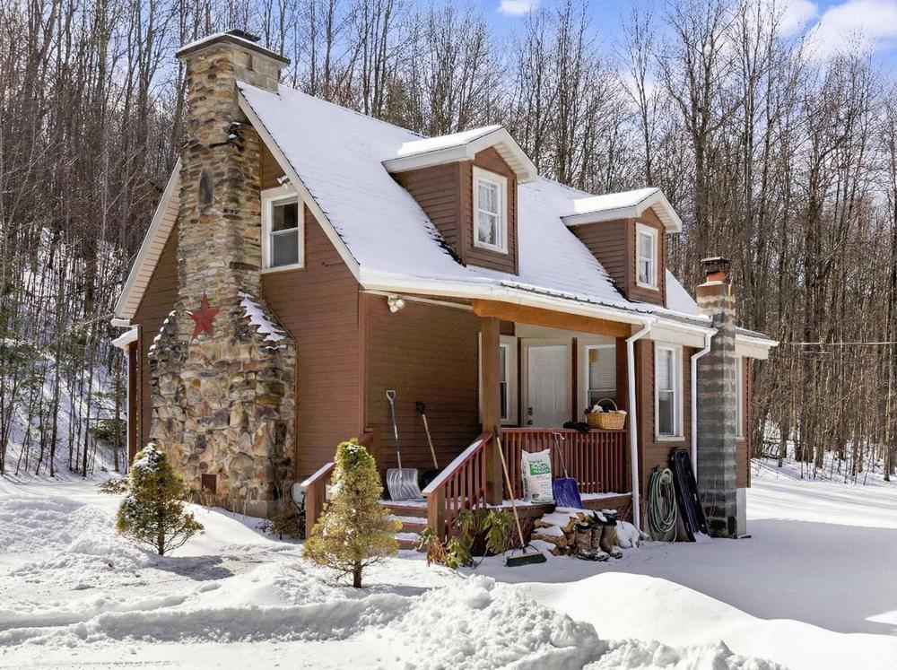 Exterior before preparation - cluttered with items and debris