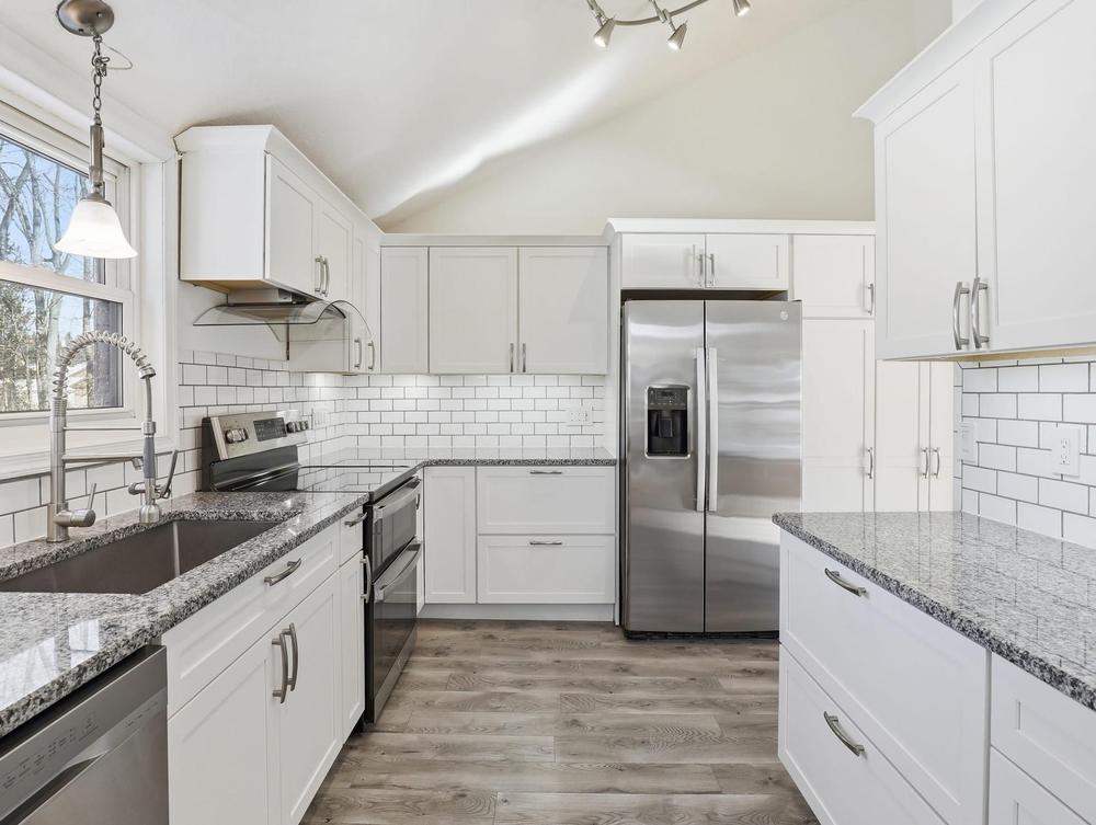 A kitchen viewed during an open house showing
