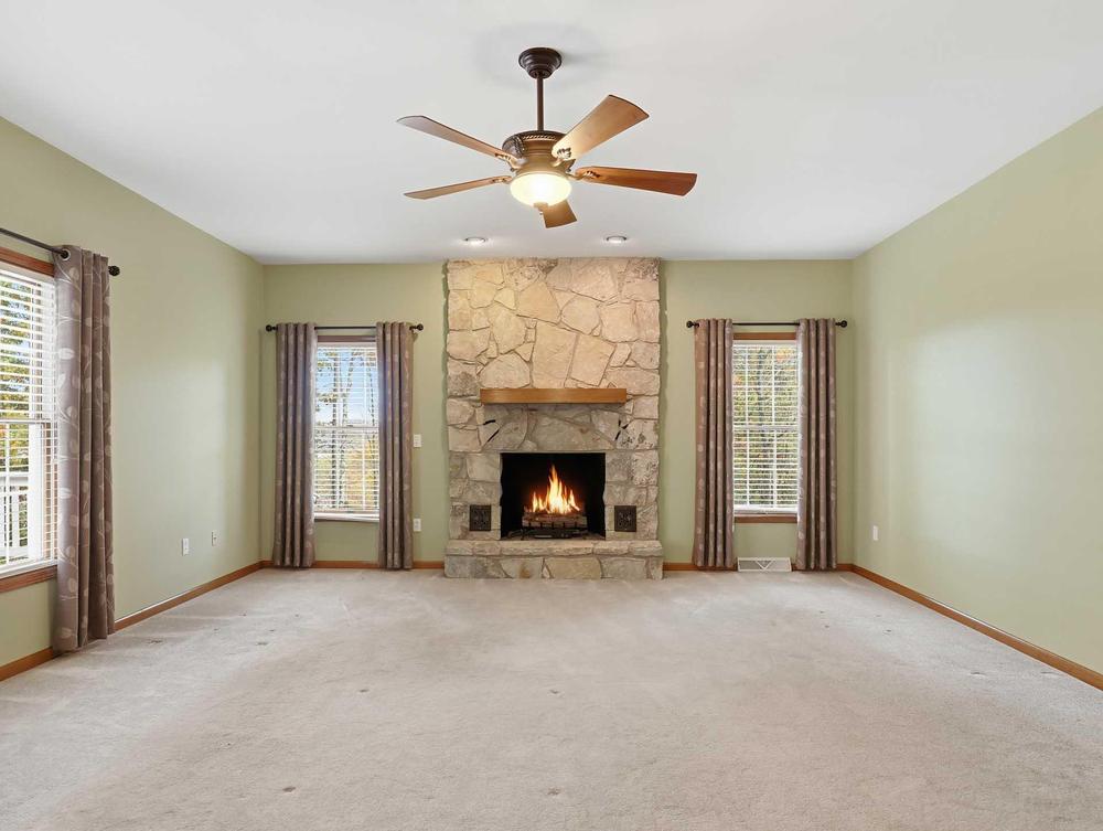 Living room with fireplace – the kind of interior shot that belongs in your listing presentation